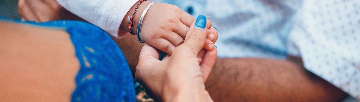 Man, woman and baby hands