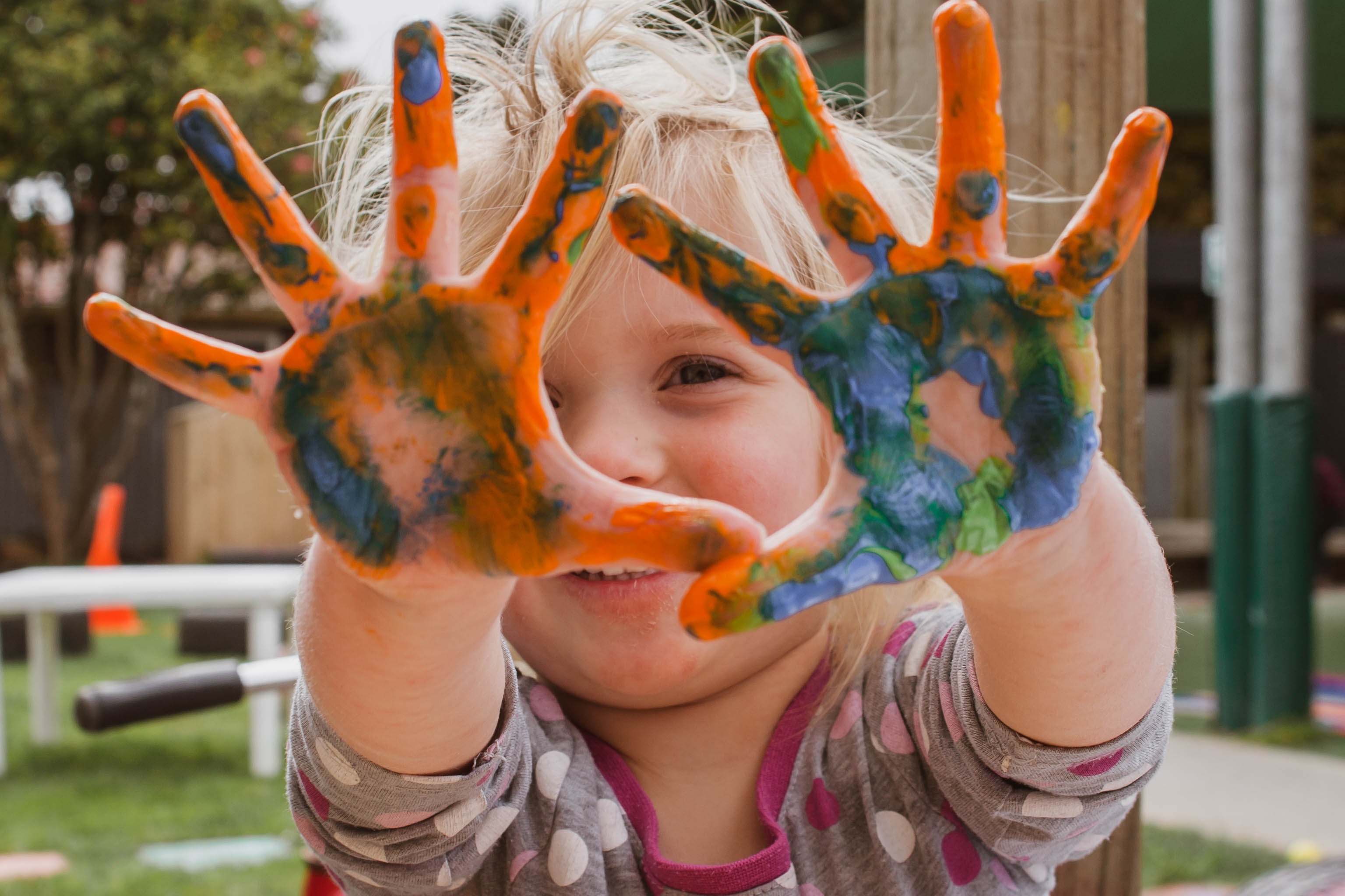 Small child with painted hands