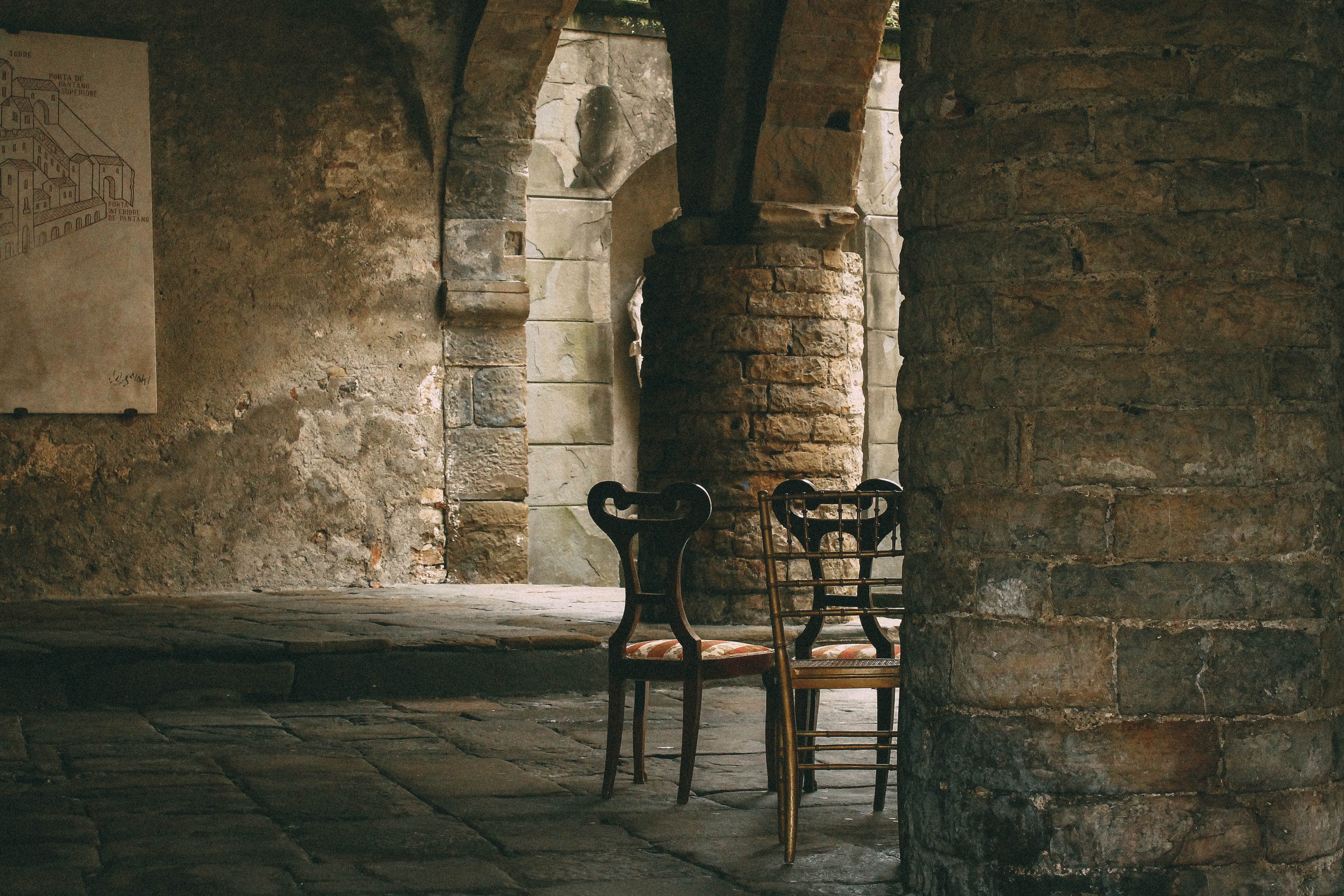 Two old chairs in an ancient building