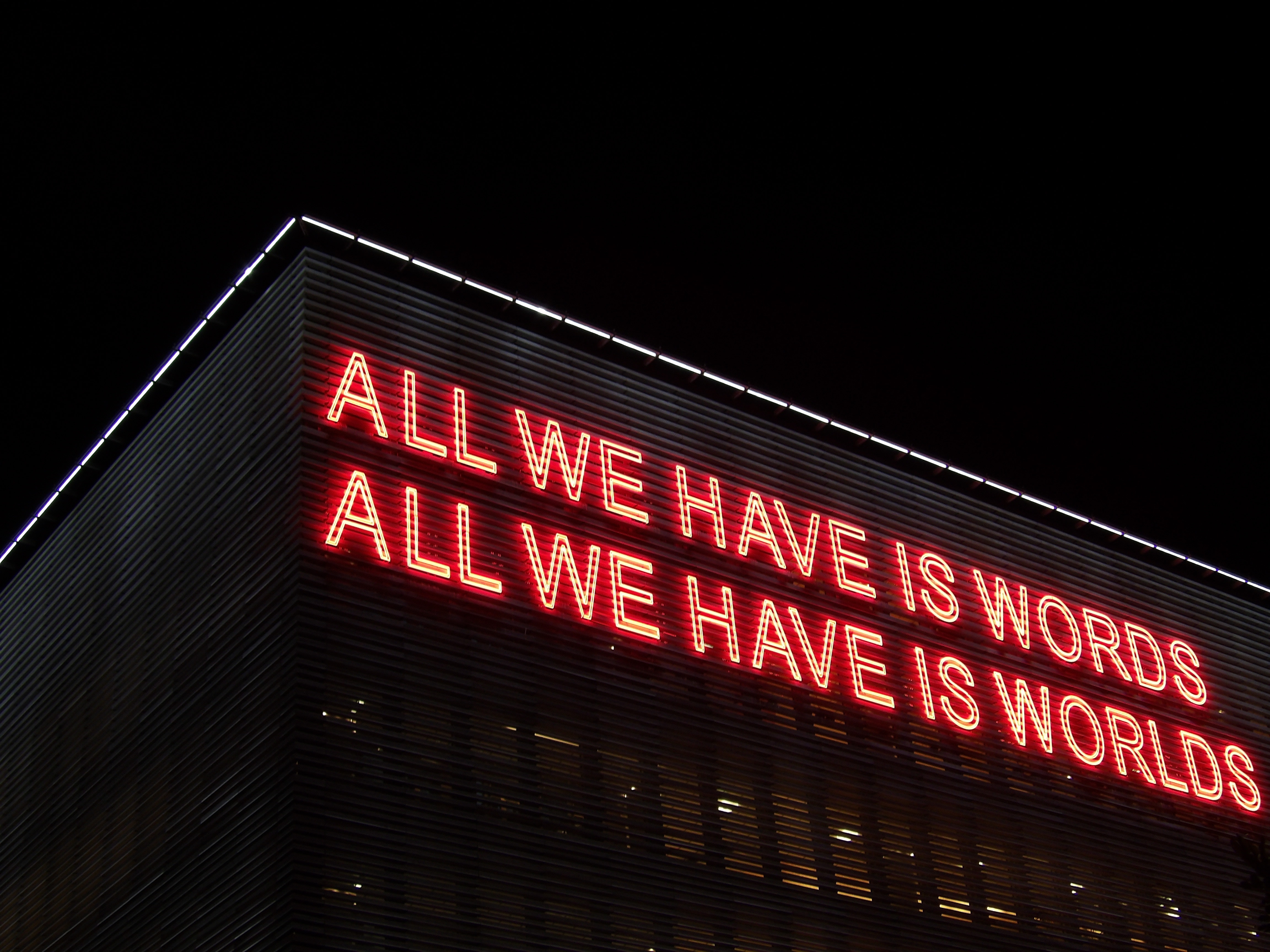 Sign "All we have is words//all we have is worlds"