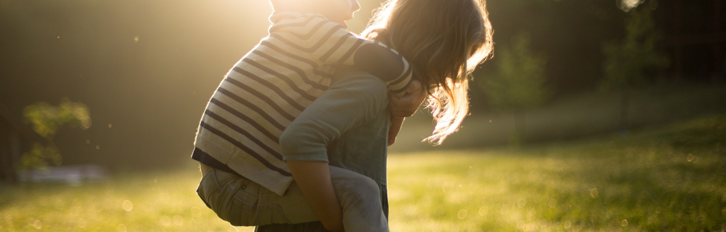 boy-1846236_1920.jpg Small boy riding an older girls' back